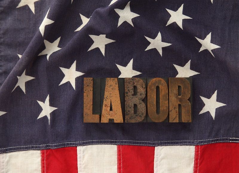 labor word on American flag cm