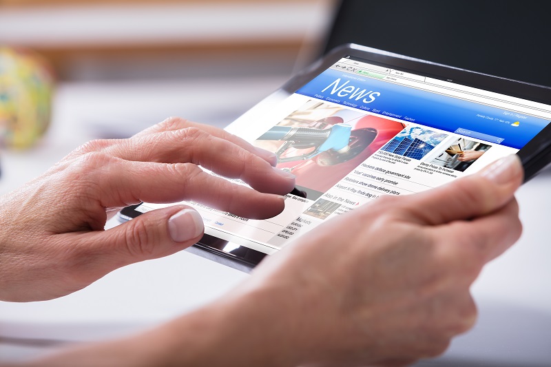 Close up Of A Persons Hand Using Digital Tablet cm