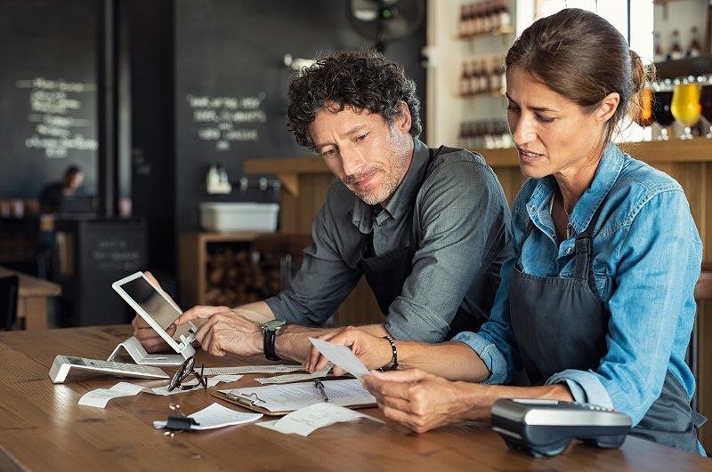 Staff calculating restaurant bill cm