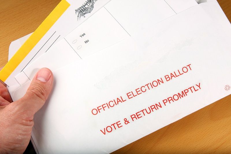 Man opening mail in ballot cm