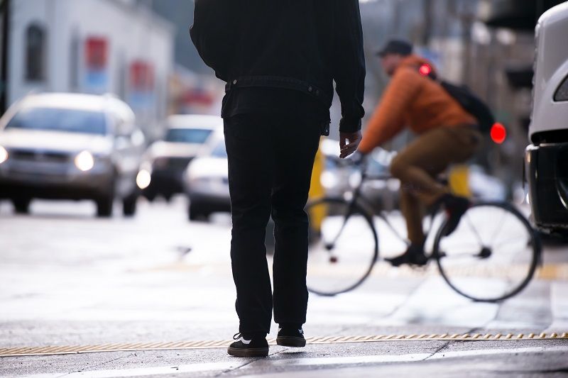 Silhouette of pedestrian on background of other urban transport cm