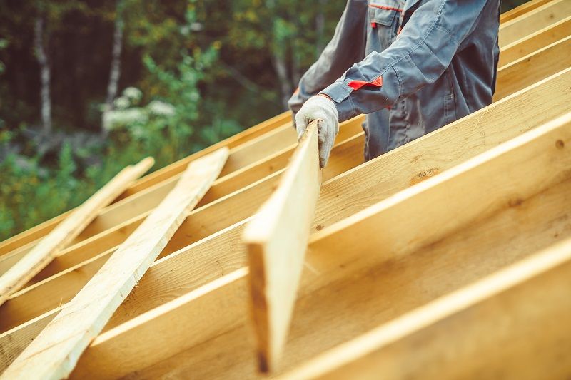 the worker is building the roof cm