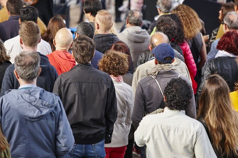 Group of people listening on the street. Crowded background cm