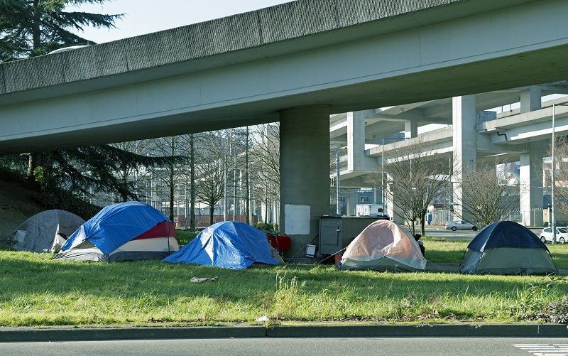 Homeless encampment below freeway in Seattle WA cm
