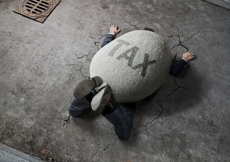 Businessman crushed by a stone cm