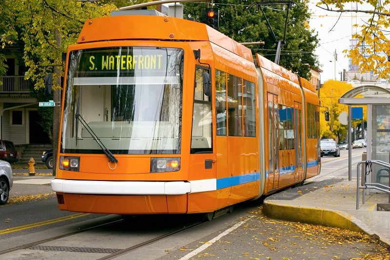An orange Portland streetcar for the S. Waterfront route cm